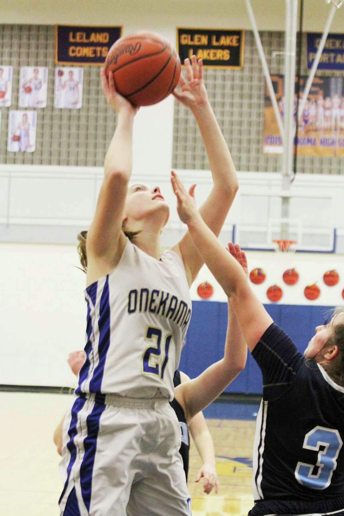 Onekama's Sophie Wisniski goes up with a put-back during the Portagers' district quarterfinal victory over Brethren on Monday. (Dylan Savela/News Advocate)