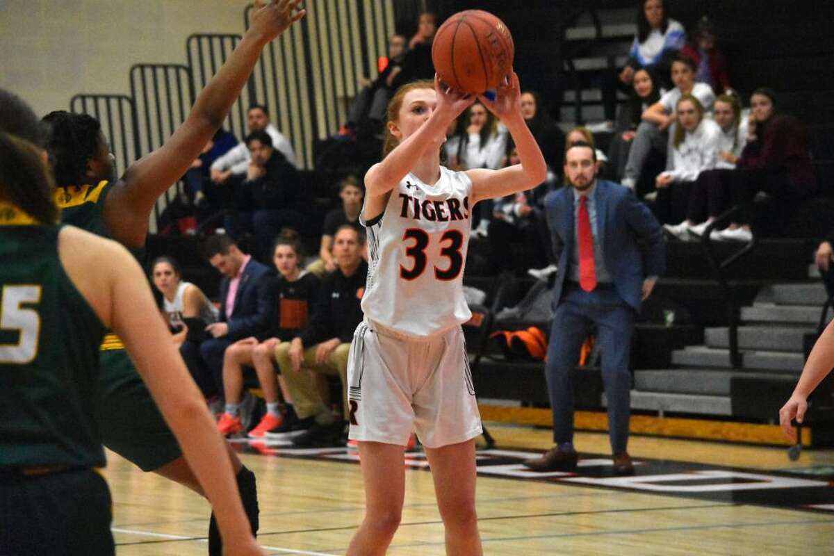 Claire Tannian takes a shot during Ridgefield's game against Hamden in the Class LL state tournament.