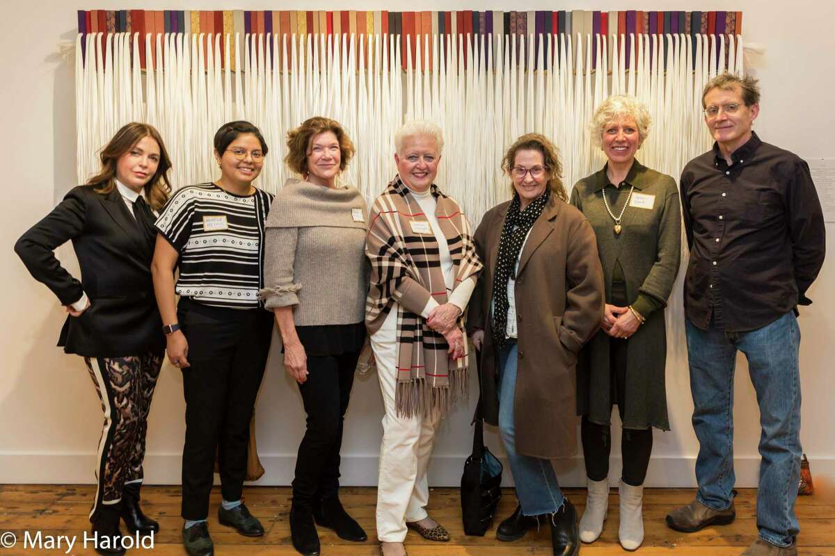 Exhibiting artists Sonia Bombart, Angela Miskis, Connie Brown, Kathleen Wrampe, Sharon Butler (juror), Karen Kent, and Chris Perry at Ridgefield Guild of Artists' 2-1-2 juried exhibition in front of one of Chris Perry's pieces.