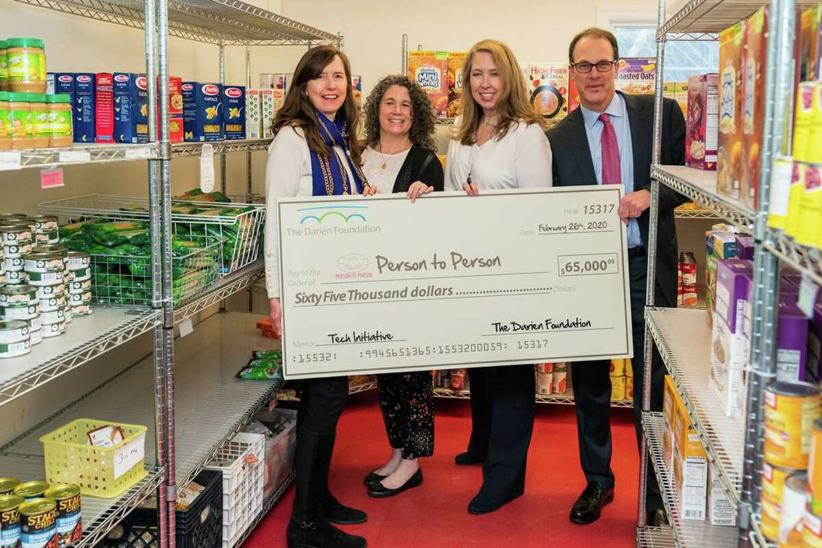 Sarah Woodberry, Executive Director of the Darien Foundation; left, Tracy Cramer, Chief Philanthropy Officer at Person-to-Person; Nancy Coughlin, CEO of Person-to-Person; Ward Glassmeyer, chairman of the Board of Directors of The Darien Foundation