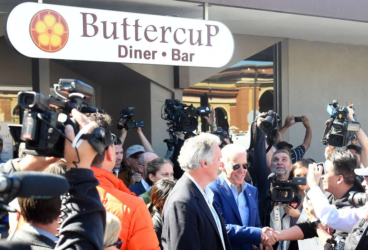 Democratic presidential candidate Joe Biden greets members of the media at Buttercup Diner in Oakland, California on March 03, 2020.