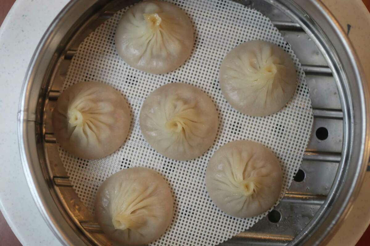 Steamed soup dumplings stuffed with pork at One Dragon in Houston.