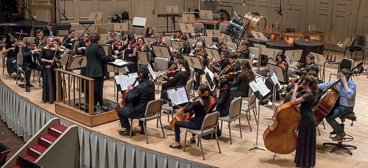 Members of the Staples High School Chamber Orchestra, on a recent trip to Boston, play on the stage of Symphony Hall as part of a master class with a Boston Symphony musician in 2016.