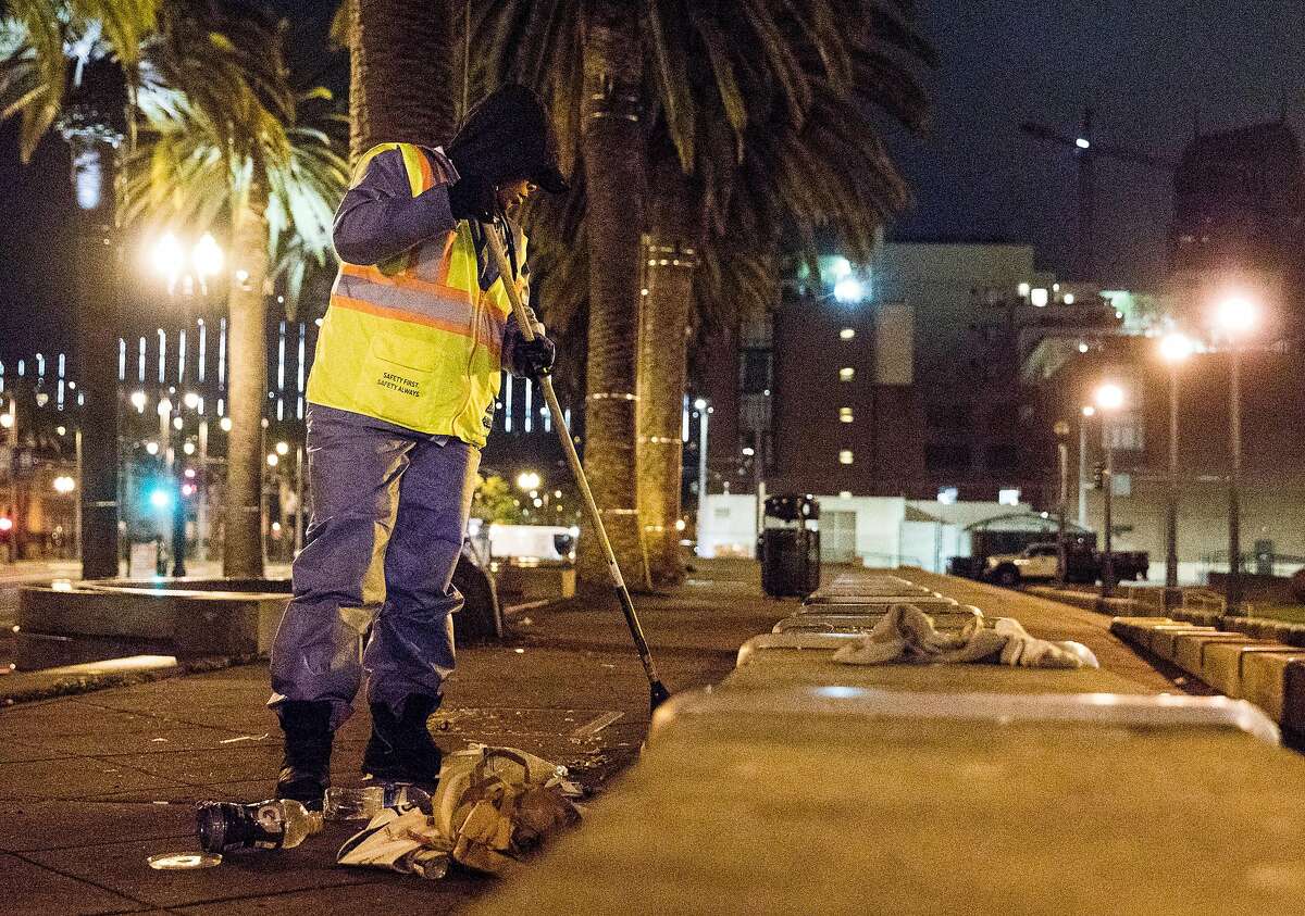 4:25 a.m. Embarcadero Plaza at Market Street A San Francisco Department of Public Works employee sweeps the walkway of the Embarcadero Plaza in San Francisco, Calif. Wednesday, June 19, 2019.