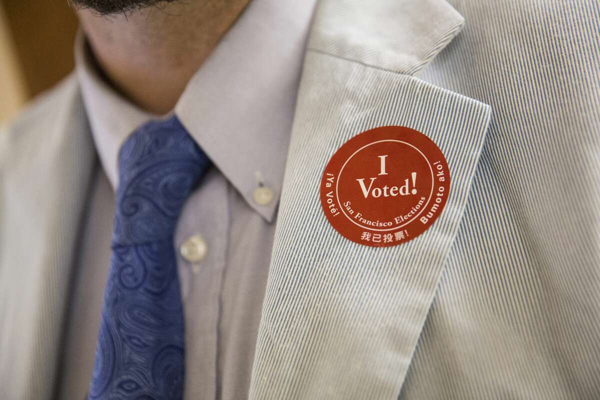 A man wears an "I Voted!" sticker after voting in the California primary on June 7, 2016, at City Hall in San Francisco.