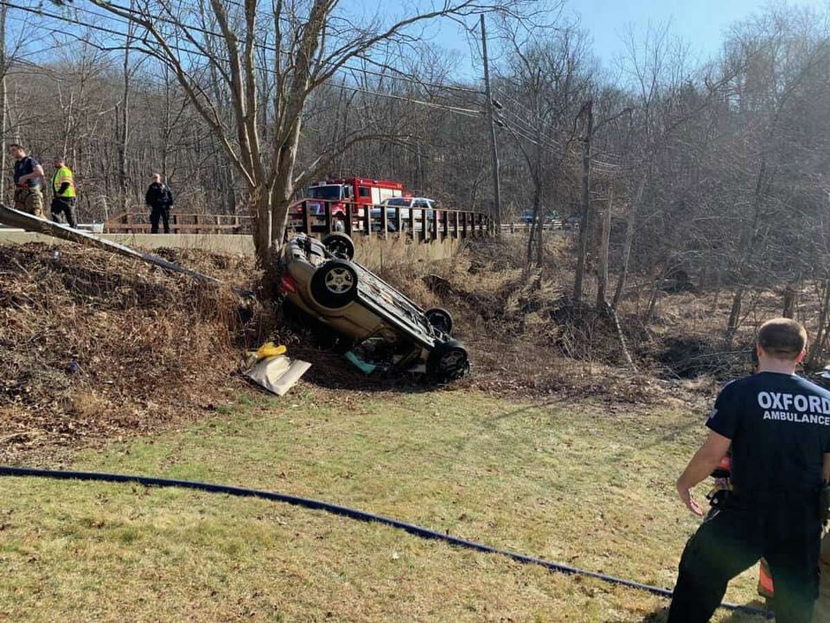 First responders on scene for a rollover in the area of Hogs Back Road and Oxford Road in Oxford, Conn., on Monday, March 2, 2020.