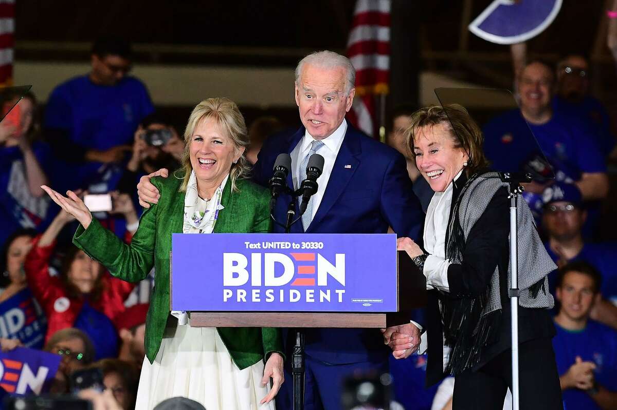 Democratic presidential hopeful former Vice President Joe Biden (C) arrives onstage with his wife Jill and sister Valerie (R) for a Super Tuesday event in Los Angeles on March 3, 2020. (Photo by FREDERIC J. BROWN / AFP) (Photo by FREDERIC J. BROWN/AFP via Getty Images)