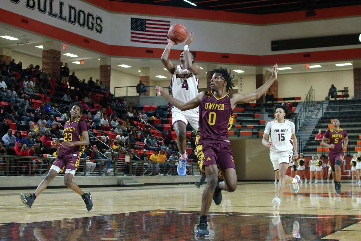Summer Creek's Dylan Miles (4) lays up a shot over Beaumont United's Kendris Henry (0) Tuesday, Feb. 3. at the La Porte High School Multi-Purpose Facility.