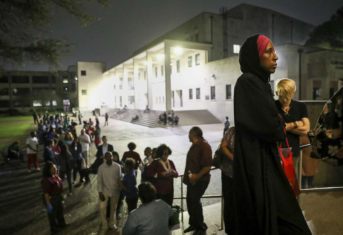 "I can remember when I did not have the right to vote," said Nancy Glenn Griesinger, second from right, when asked why she waited so long in line to vote Tuesday, March 3, 2020, at Texas Southern University in Houston. After 10 p.m., a line of people still stretched out of the Robert James Terry Library as they waited to cast their votes.