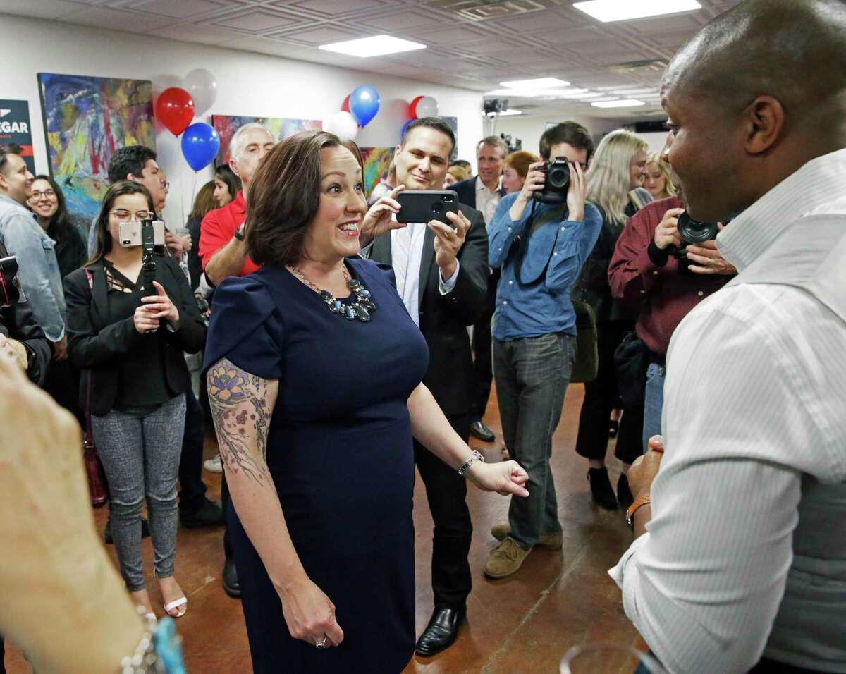 Leading Senate candidate MJ Hegar visits with supporters at the offices of The Riveter in Austin after the polls closed Tuesday night.