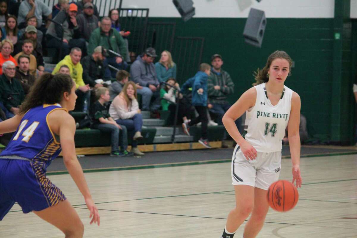 Madi Sparks (14) gets set to make a play for Pine River in recent action. (Herald Review/John Raffel)