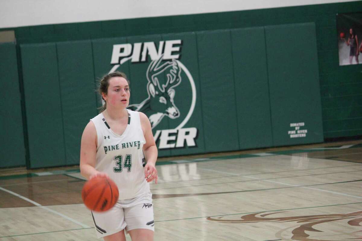 Pine River's Chelsea Wanstead brings the ball down court against Manton. (Herald Review file/John Raffel)