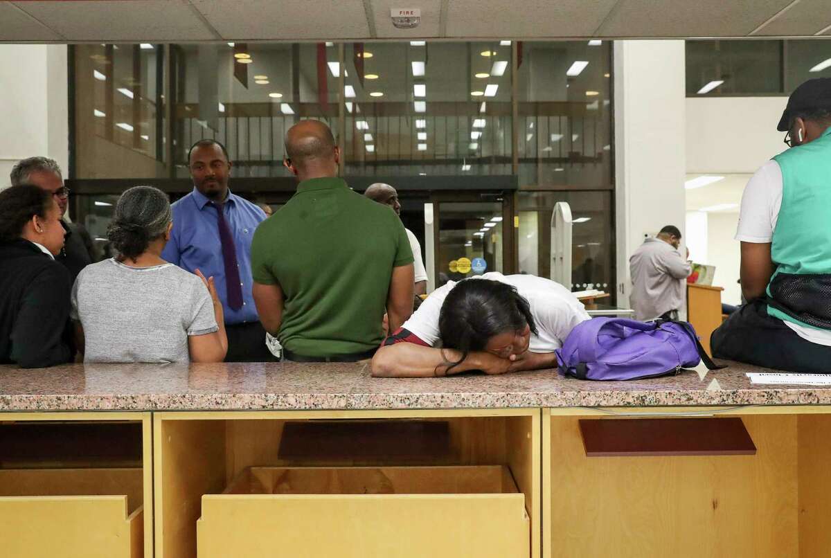 Whitney Howard, an undergrad student at Texas Southern University, rests her head as she waits in line to vote around midnight Tuesday, March 3, 2020, at Texas Southern University in Houston. As of midnight, she had not yet voted. "I want to make sure my vote counts," she said.