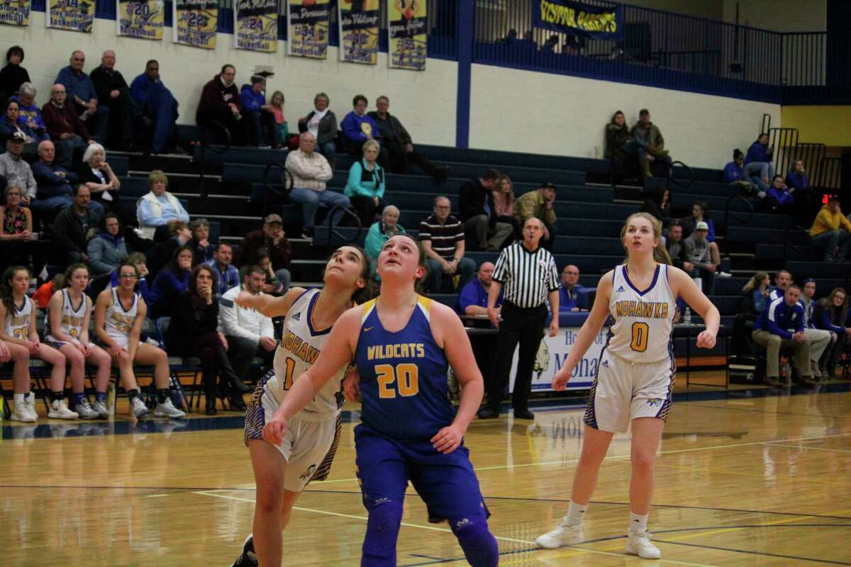 Evart's Kelci Elder (20) gets set to battle Morley Stanwood's Braelyn Berry for a possible rebound. (Herald Review photo/John Raffel)