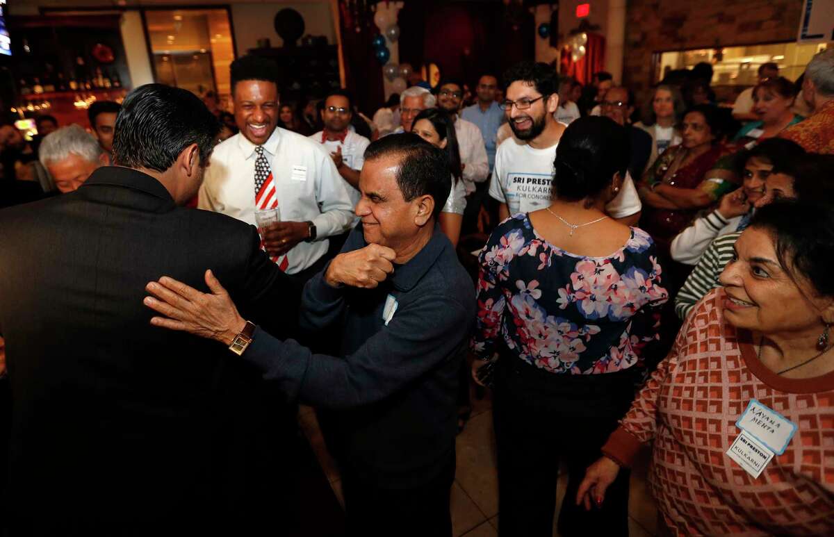 Sri Kulkarni, Democratic nominee in the House District 22 race, greets supporters with an elbow bump at his watch party at Turquoise Grill & Bar in Sugar Land,Tuesday, March 3, 2020.