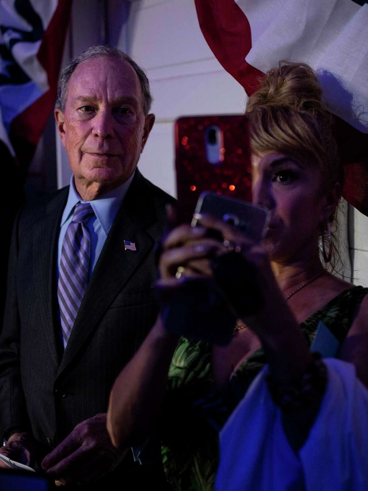 Former Mayor Michael R. Bloomberg takes a selfie with a supporter as he waits to take the stage for his campaign rally in San Antonio, Texas ahead Super Tuesday on Sunday, March 1, 2020.