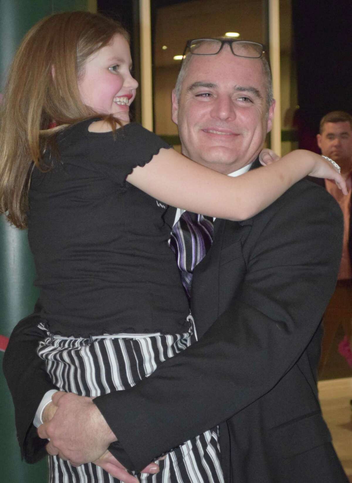 Chris McCarthy and his daughter, Nora Merkel, share a dance during the festivities.