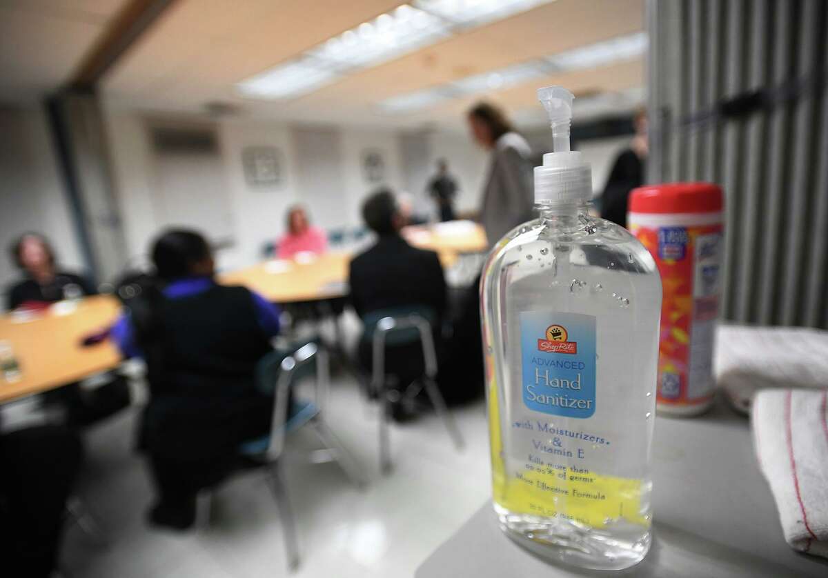 With coronavirus on everyone's mind, hand sanitizer and disinfectant wipes are on hand as Barbara Dalio meets with community members and educators at the Carver Community Center in Norwalk, Conn. on Tuesday, March 3, 2020.