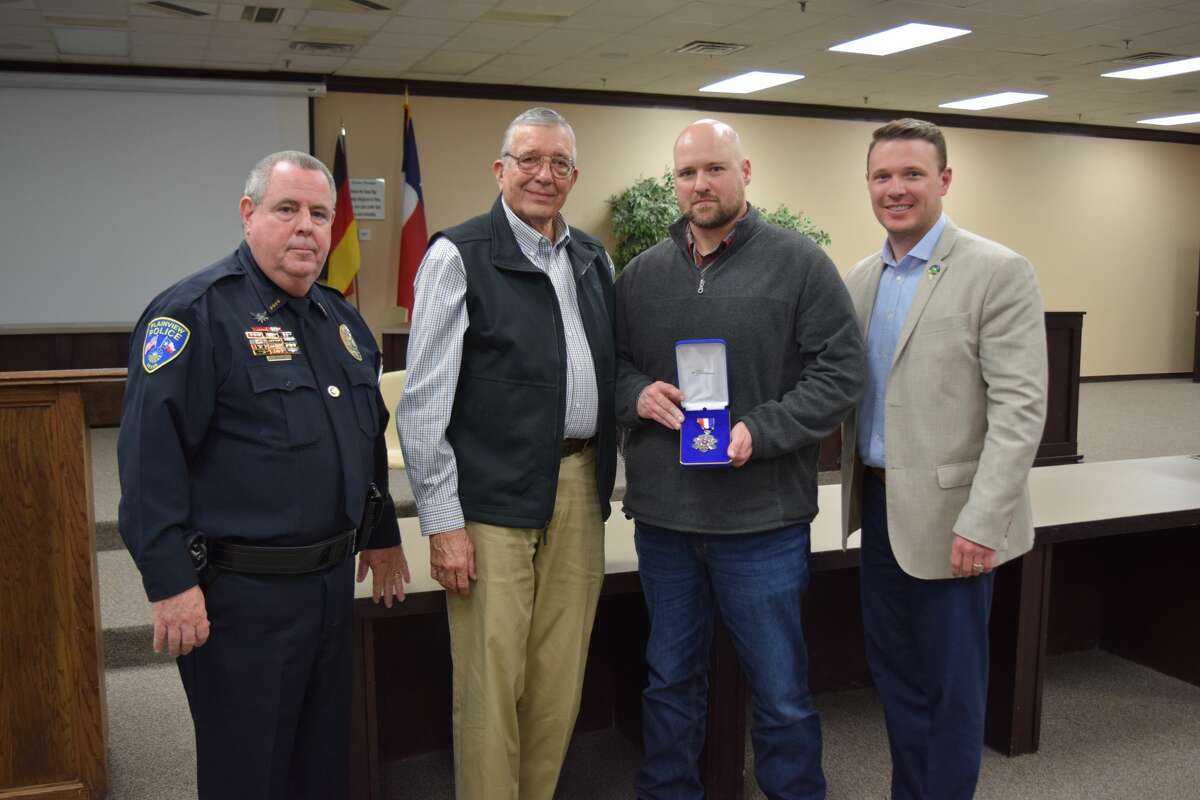 Corporal Josh Vanbebber was presented with the Plainview Police Department's second highest honor - the Medal of Valor - during the department's sixth annual Employee Recognition Awards Dinner on Feb. 28, 2020. Police Chief Ken Coughlin said the award stems from the bravery Vanbebber showed during a callout in September. Pictured (L-R): Ken Coughlin, Plainview Mayor Wendell Dunlap, Vanbebber, City Manager Jeffrey Snyder