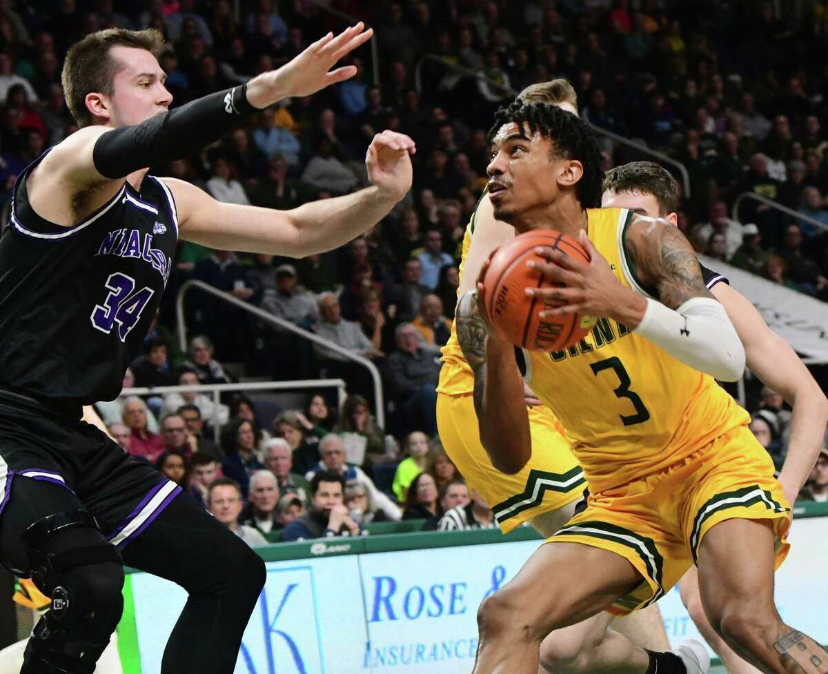Siena's Manny Camper drives to the basket during a game against Niagara at Times Union Center last season. He announced on Wednesday that he has withdrawn from the NBA draft and will return to the Saints for his senior season. (Lori Van Buren/Times Union)