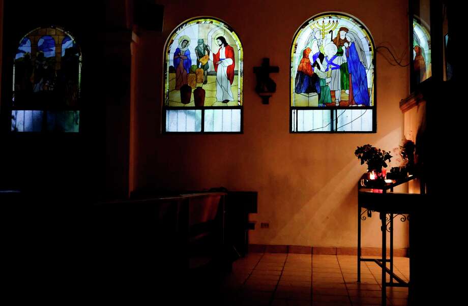Painted glass windows let in some evening light at Our Lady of the Incarnation in the Camino Verde neighborhood of Tijuana on Nov. 9, 2019. Photo: Elizabeth Conley, Staff Photographer / © 2020 Houston Chronicle USE ONLY IN International Priests article March 2020 and social media associated with this article. Thi