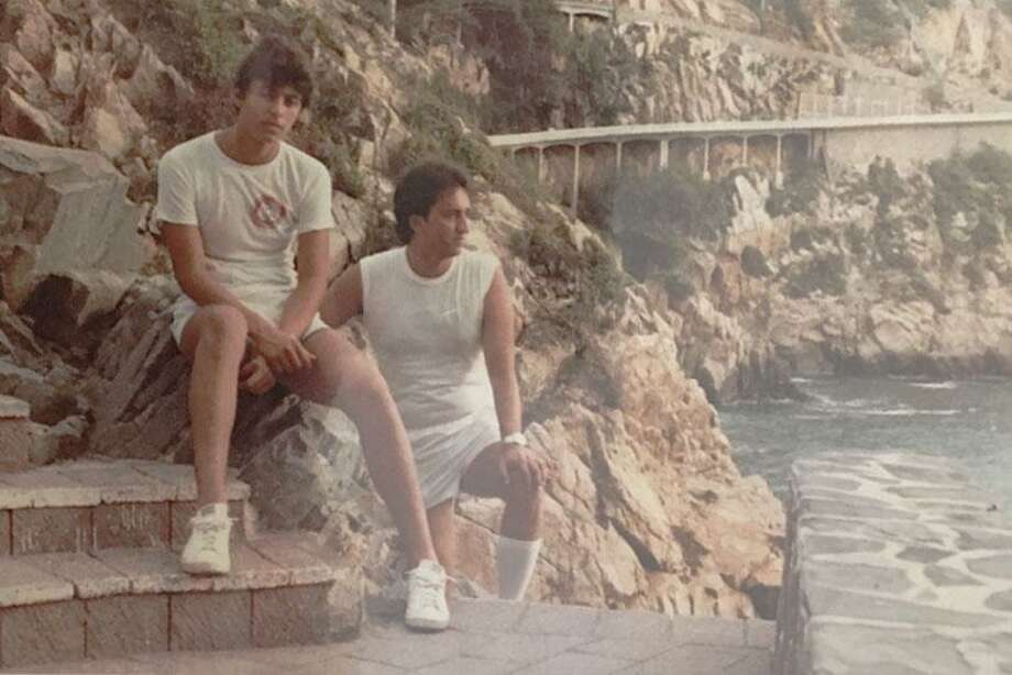 A photograph of Torres, left, and Pinal on vacation in Mexico from a photo album at Pinal’s home shown to and photographed by a reporter.