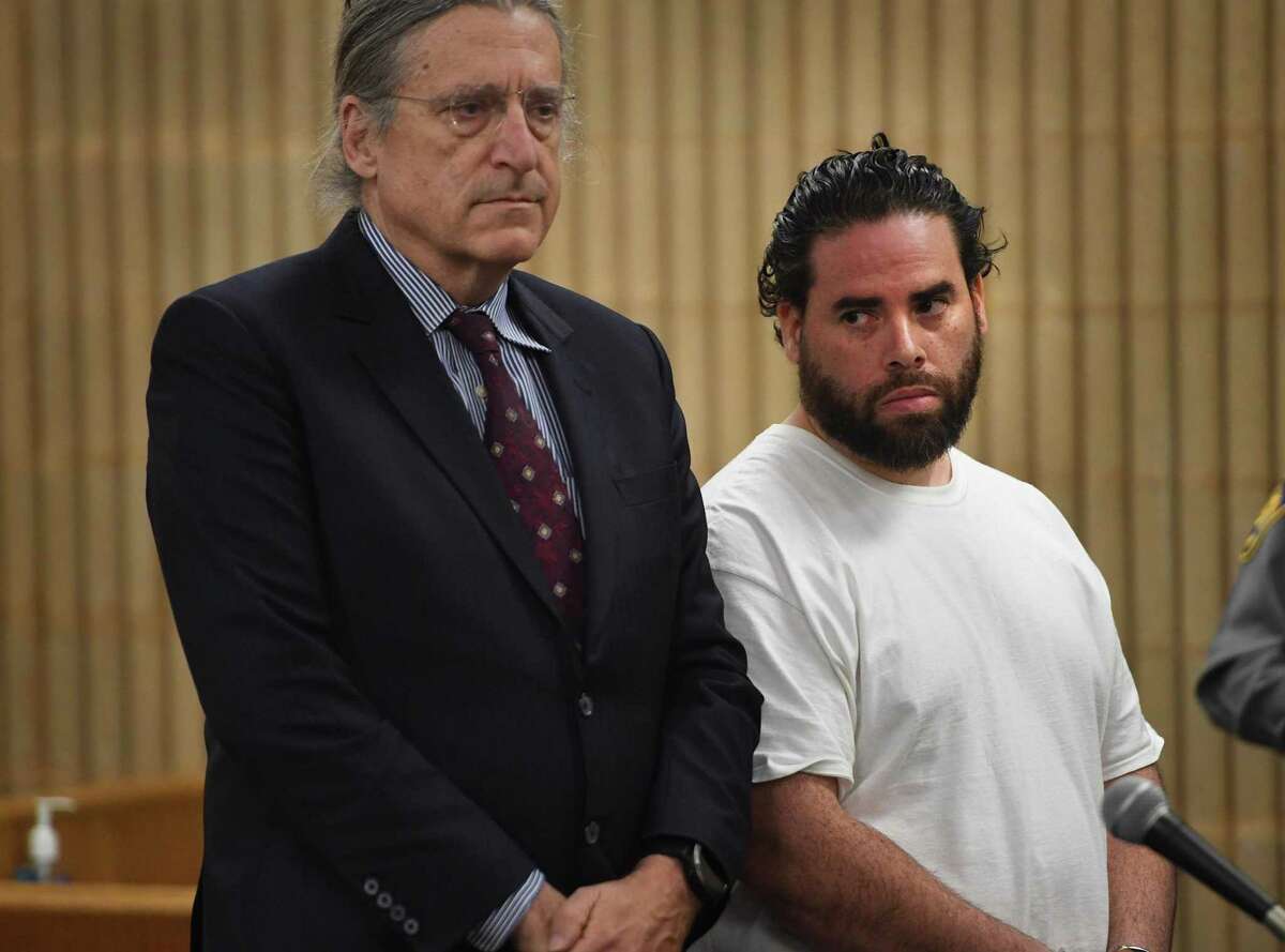 Standing beside his lawyer, Norm Pattis, left, Jose Morales appears in Superior Court in Milford, Conn. on Thursday, March 5, 2020.