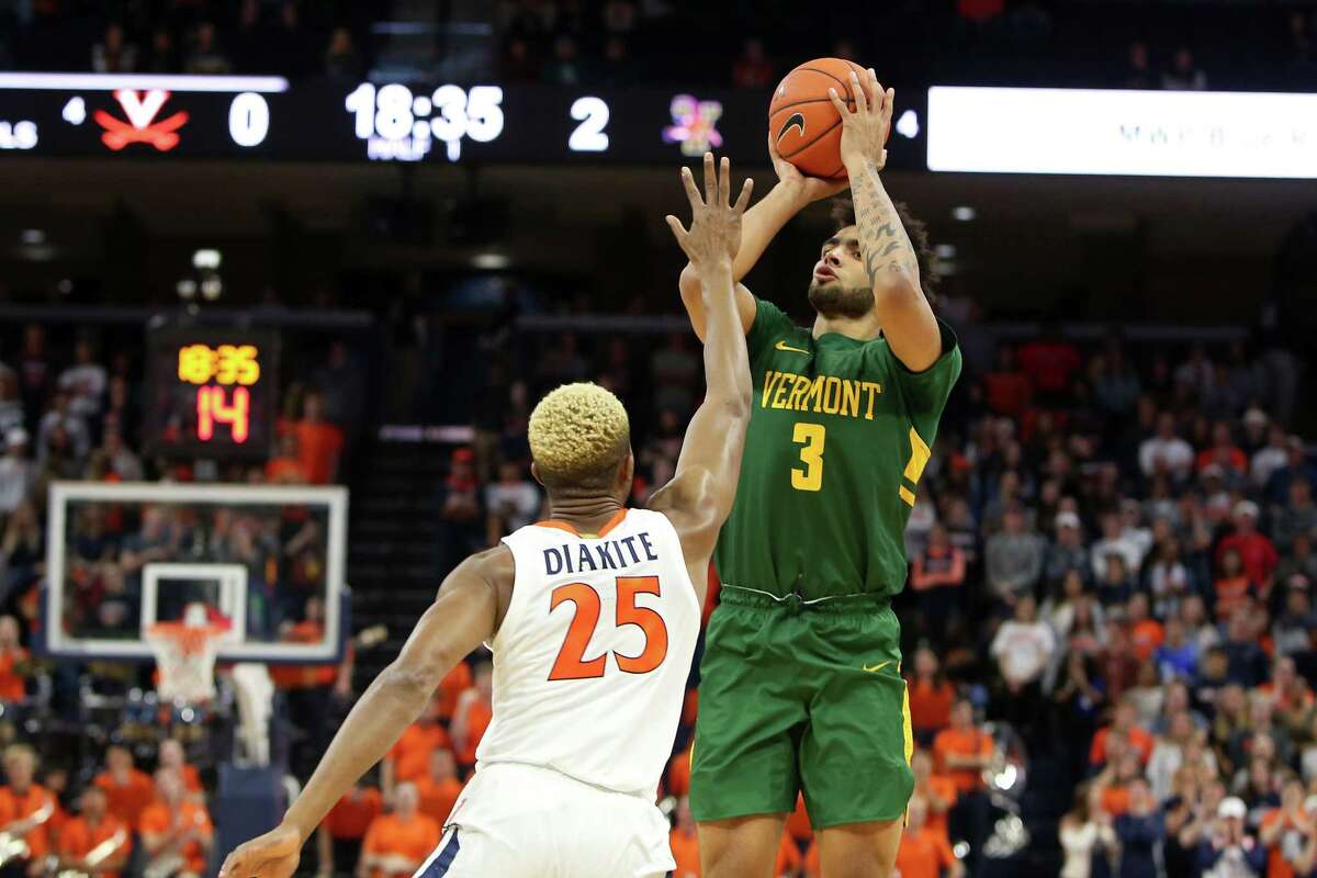 CHARLOTTESVILLE, VA - NOVEMBER 19: Anthony Lamb #3 of the Vermont Catamounts shoots over Mamadi Diakite #25 of the Virginia Cavaliers in the first half during a game at John Paul Jones Arena on November 19, 2019 in Charlottesville, Virginia. (Photo by Ryan M. Kelly/Getty Images)