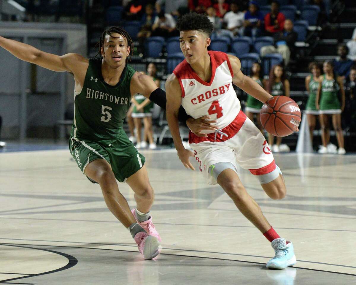 PJ Haggerty (4) of Crosby drives toward the paint during the fourth quarter of the Boys 5A Region III Quarterfinal basketball game between the Hightower Hurricanes and the Crosby Cougars on Tuesday, March 3, 2020 at Delmar Fieldhouse, Houston, TX.