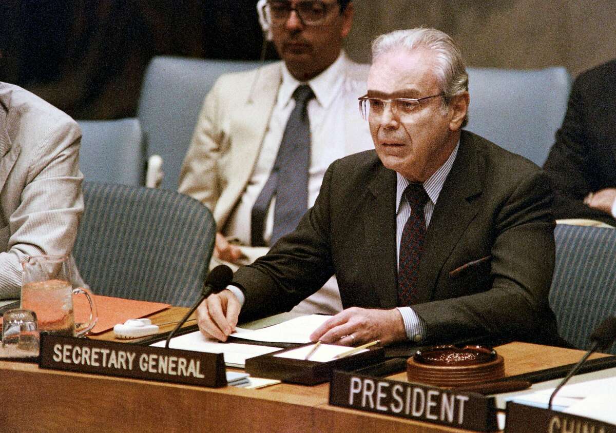 (FILES) In this file photo taken on August 08, 1988 UN Secretary General Javier Perez de Cuellar announces a cease-fire in the Iran-Iraq war will begin on August 20 during a special session of the UN Security Council, at UN headquarters in New York. - Perez de Cuellar died on March 3, 2020 Lima at the age of 100, his son reported. (Photo by Mark CARDWELL / AFP) (Photo by MARK CARDWELL/AFP via Getty Images)