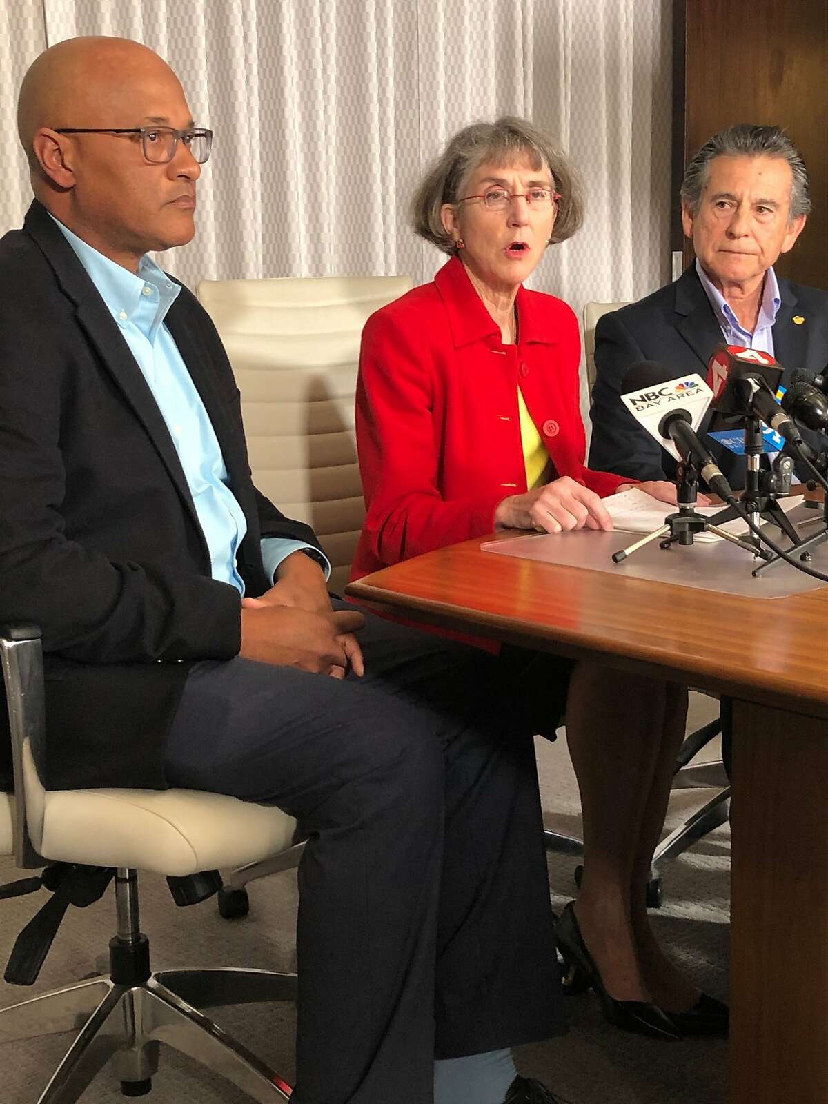 Flanked by former Oakland Police Chief Howard Jordan and Oakland city Councilman Noel Gallo, fired Oakland police Chief Anne Kirkpatrick calls for the removal of Oakland police monitor Robert Warshaw at a downtown Oakland press conference on Thursday, March 5, 2020.