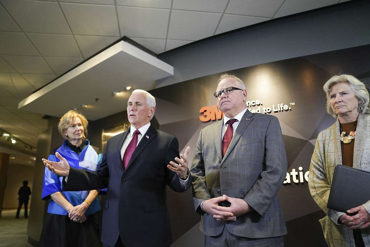 Vice President Mike Pence and Minnesota Governor Tim Walz speak to the press after Pence visited 3M World Headquarters in Maplewood, Minnesota, Thursday, March 5, 2020 meeting with 3M leaders and Minnesota Governor Tim Walz to coordinate response to the COVID-19 virus. On the left is Dr. Deborah Birx, ambassador and White House Coronavirus response coordinator. On the right is MDH Commissioner Jan Malcolm. (Glen Stubbe/Star Tribune via AP)