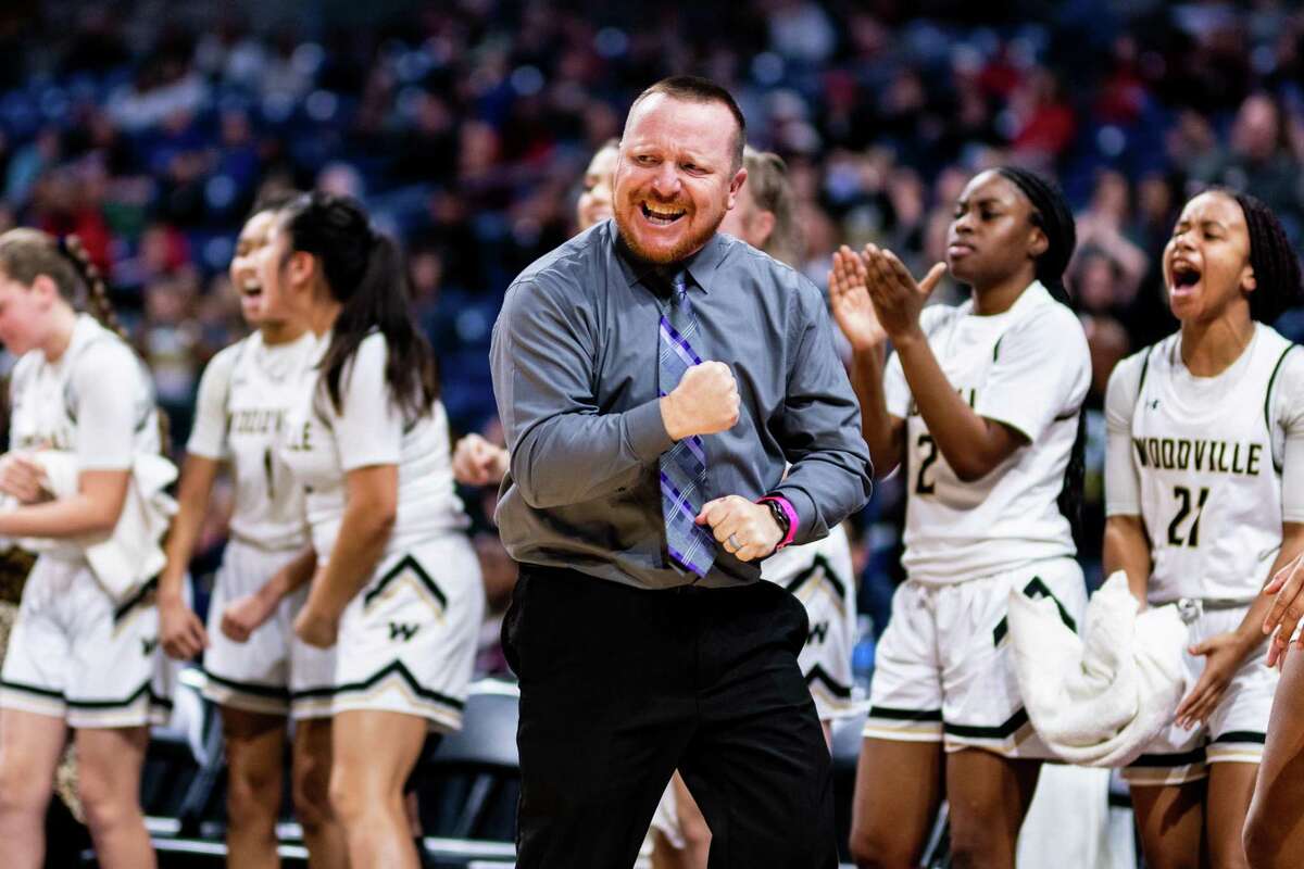 Head coach of the Eagles Troy Carrell celebrates as his team narrowes Winnsboro's lead in the 3rd quarter of the 3A State Semifinal between Woodville and Winnsboro at the Alamodome in San Antonio on March 5th, 2020.