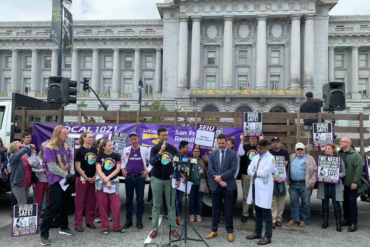 Health workers rally outside City Hall to advocate for better staffing and resources. Nurses said SF General Hospital is not prepared for an outbreak.