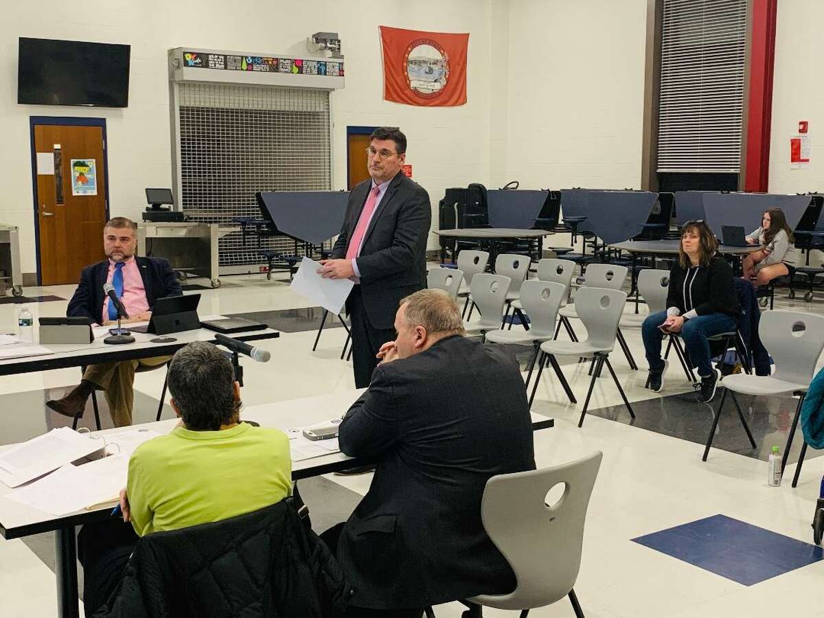 Rick Dunne, executive director of the Naugatuck Valley Council of Governments, urges the Ansonia-Derby Temporary School Regionalization Study Committee to withhold a $23,100 payment to their consultant because at least three requirements of their final report are incomplete.