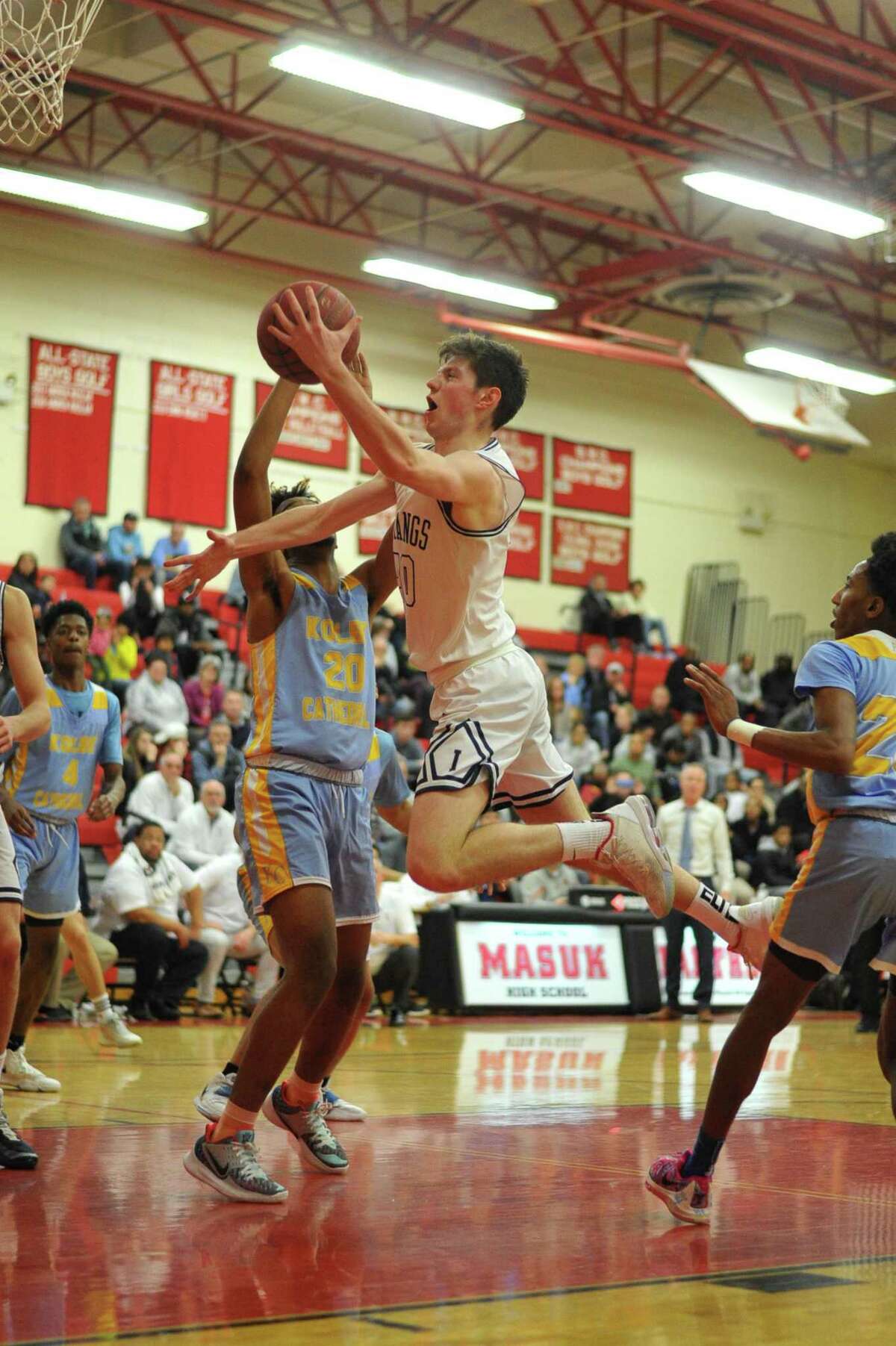 Michael Iannetta (10) of the Immaculate Mustangs drives to the basket during the SWC Boys Basketball Championship against Kolbe Cathedral on Thursday March 5 ,2020 at Masuk Hig School in Monroe, Connecticut.