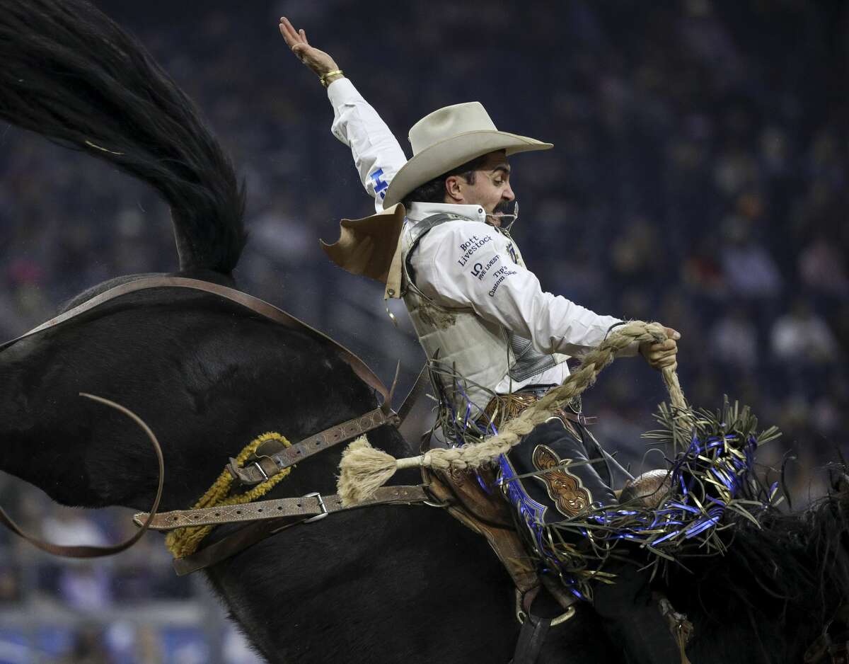 Saddle bronc rider Rusty Wright was down, but he wasn't out