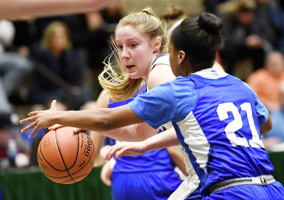 Saratoga's Abby Ray (4) moves the ball against Shaker's Kj Gordon (21) during a girls' Section II Class AA high school semifinal basketball game Thursday, March 5, 2020 in Troy, N.Y. (Hans Pennink / Special to the Times Union) ORG XMIT: 030620_hsbb_girls1_HP122