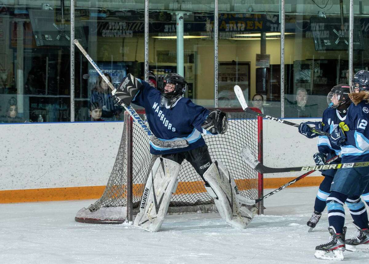 Wilton goalie Erin McMorris turns away a shot during a game this season.