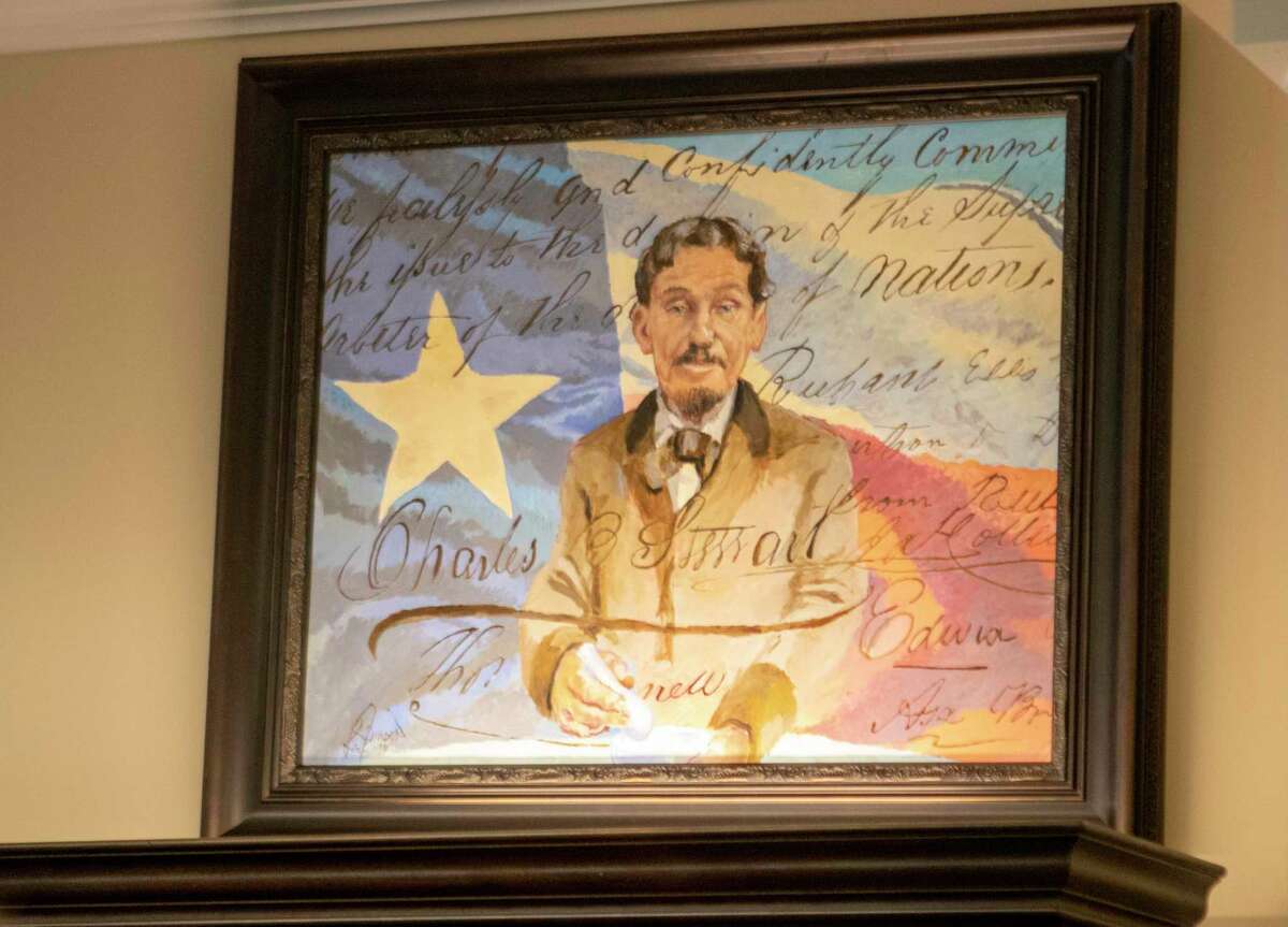 A new portrait of Charles B. Stewart is unveiled during a grand opening ceremony Saturday, August 24, 2019 at the Spirit of Texas Bank in Montgomery.