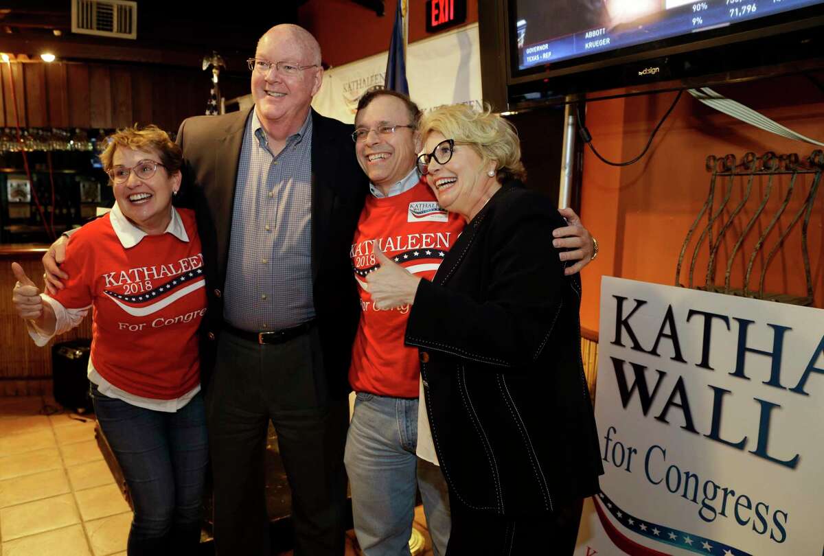 Kathaleen Wall (right), republican candidate to replace Ted Poe in Congress, poses for photos with supporters at her watch party held at the Adobe Cafe Tuesday, Mar. 6, 2018 in Houston, TX. (Michael Wyke / For the Chronicle)