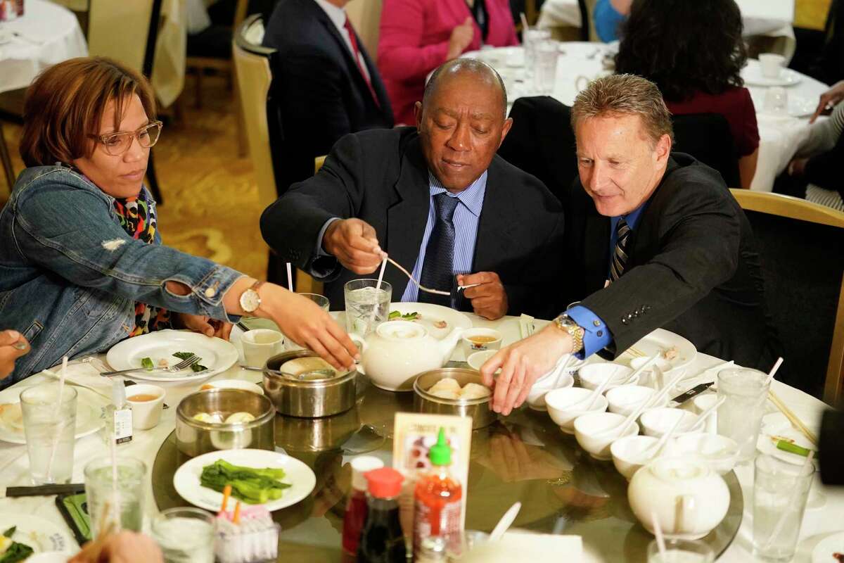 Tiffany Thomas, City Council member, left, Mayor Sylvester Turner, and George Buenik, Public Safety director, right, eat lunch at Ocean Palace Restaurant, 11215 Bellaire Blvd., Thursday, March 5, 2020, in Houston. Mayor Sylvester Turner gathered with a couple dozen staff members and city officials for lunch at Ocean Palace in Asiatown in a bid to alleviate concerns and tamp down on rumors about COVID-19.