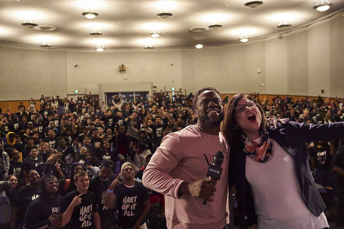 Kevin Hart and Alice Rodriguez of Chase, doing a mass selfie at Castlemont High on Friday, March 6, 2020, in Oakland, Calif.