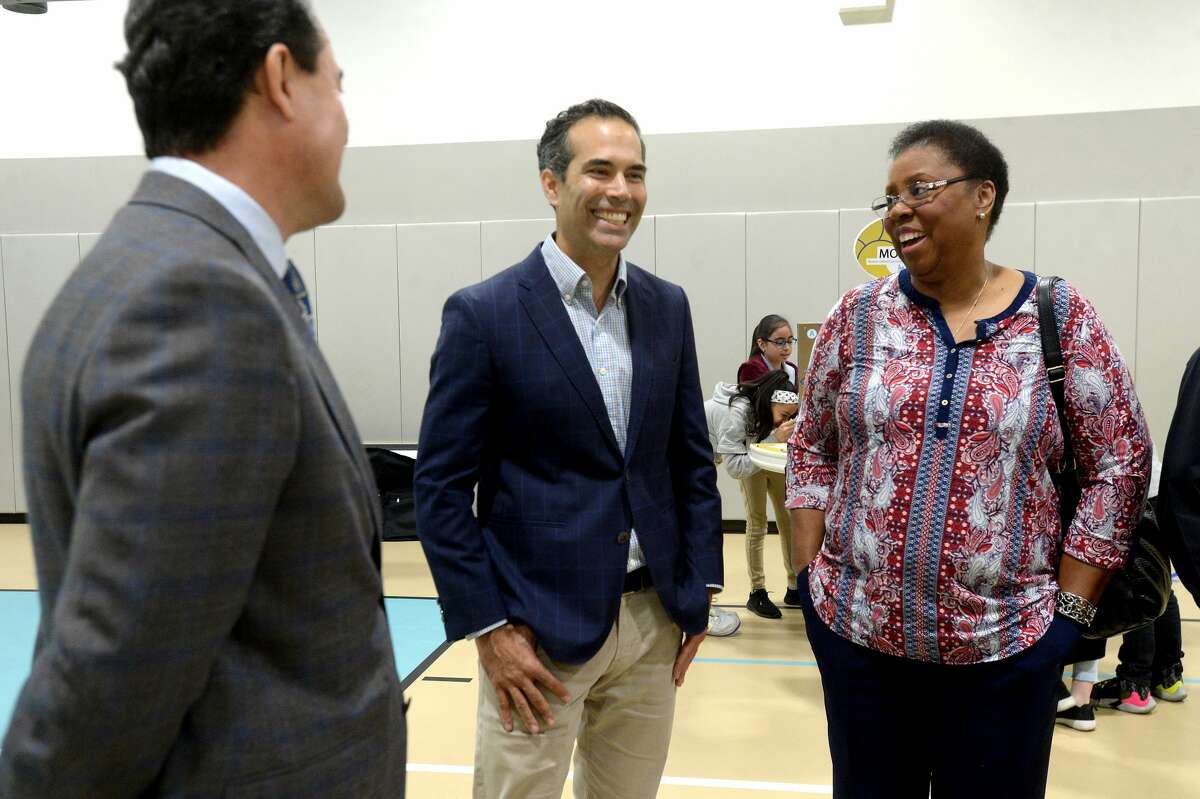 Todd Staples and George P. Bush talk with a PAISD board member as students work through stations of the Mobil Oilfield Learning Unit (MOLU), an interactive educational tool provided by the Texas Oil & Gas Association (TXOGA), at Travis Elementary School in Port Arthur Friday. Texas Land Commissioner George P. Bush and TXOGA President Todd Staples attended the morning MOLU session at the campus, as well as Jefferson County Judge Jeff Branick, PAISD Superintendent Mark Porterie, educators and representatives from area petrochemical companies. Photo taken Friday, March 6, 2020 Kim Brent/The Enterprise