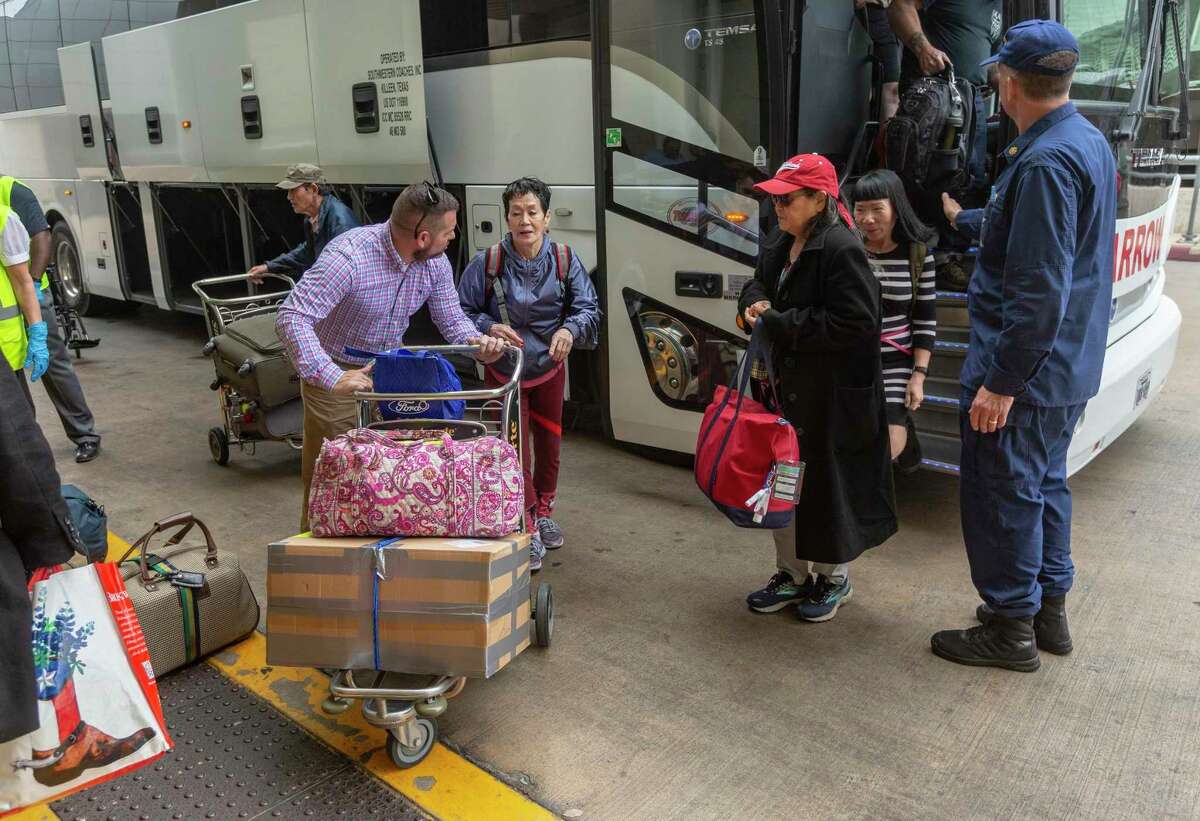Evacuees from the Diamond Princess arrive at San Antonio International Airport on Tuesday, March 3, 2020, after being released from quarantine at Joint Base San Antonio-Lackland. They were not infected by the coronavirus and were allowed to leave after 14 days under quarantine at Lackland.