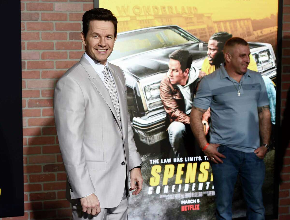 Mark Wahlberg, left, star of the Netflix film "Spenser Confidential," poses at the world premiere of the film at the Regency Village Theatre, Thursday, Feb. 27, 2020, in Los Angeles. On Thursday, the actor thanked H-E-B for helping customers through the difficult times brought on by the virus.