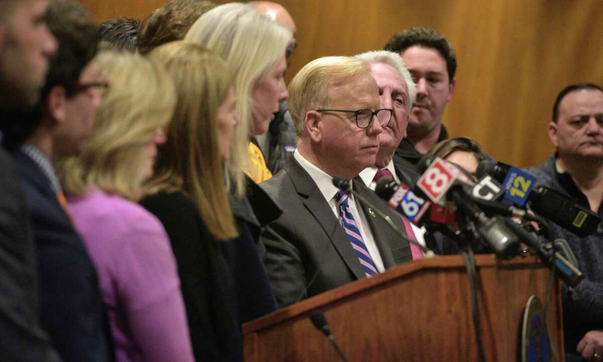 Danbury Mayor Mark Boughton, center, joined Gov. Ned Lamont and state and local officials, at a news conference to announce details of an employee from Danbury and Norwalk Hospitals that has tested positive for COVID-19, Friday, March 6, 2020, at Danbury City Hall.