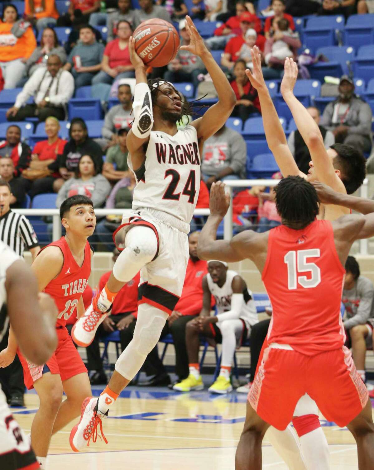 Wagner's Journee Phillips (24) attempts a score against Laredo Martin during their Boys 5A Regional semifinal basketball game on Friday, Mar. 6, 2020. Wagner defeated Laredo Martin, 58-47, to advance to the regional final game.