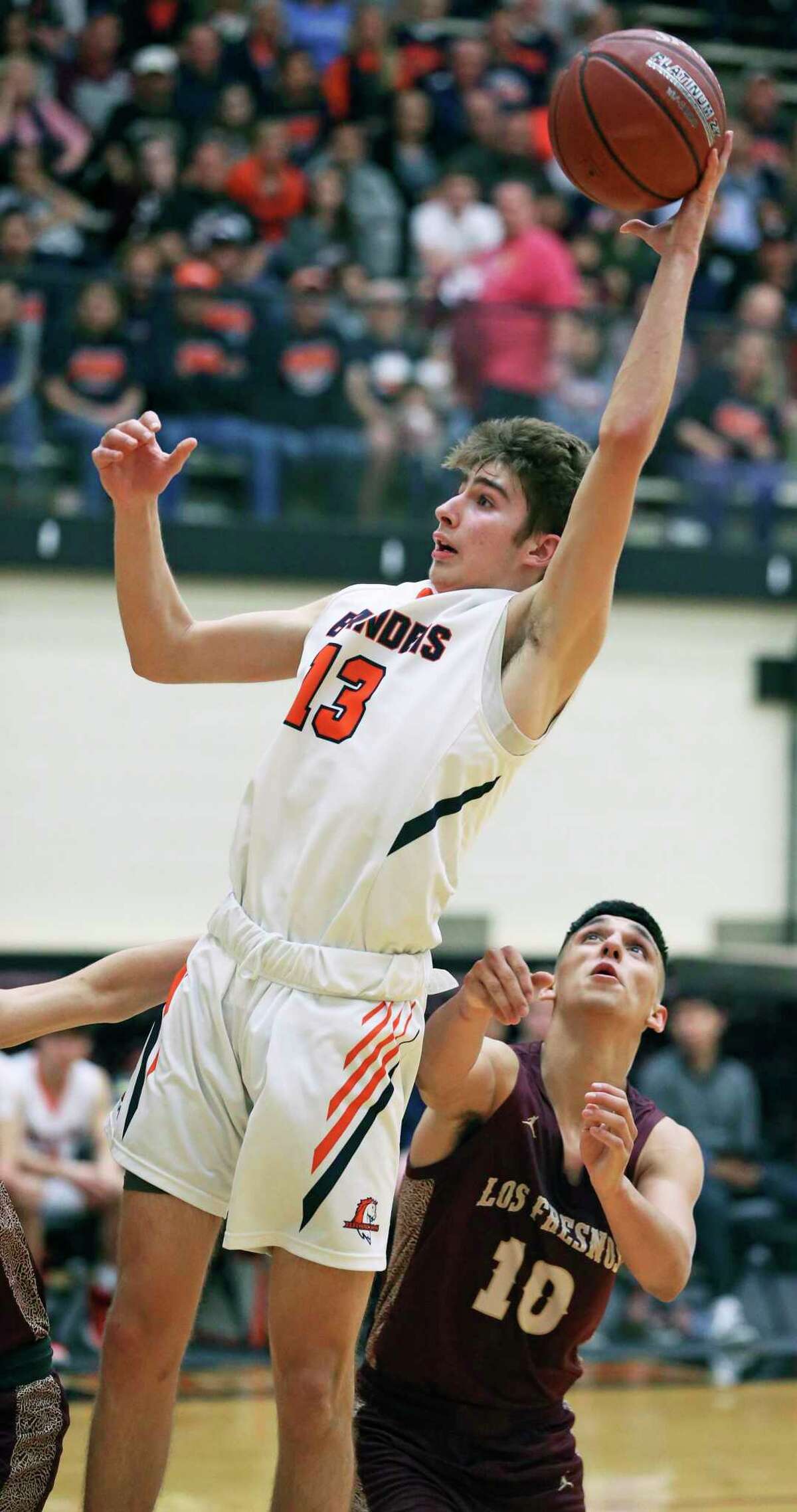 Tanner Brown claims a rebound for the Broncos as Brandeis plays Los Fresnos on Class 5A regional semifinal basketball at Littleton Gym on Feb. 6, 2020.