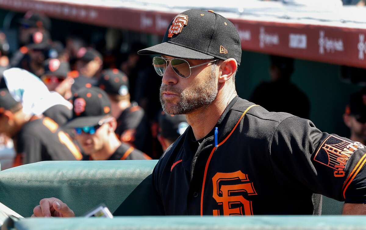 San Francisco Giants' head coach Gabe Kapler watches from the dugout before their game with the Cleveland Indians at Scottsdale Stadium Thursday, March 5, 2020, in Scottsdale, Arizona.